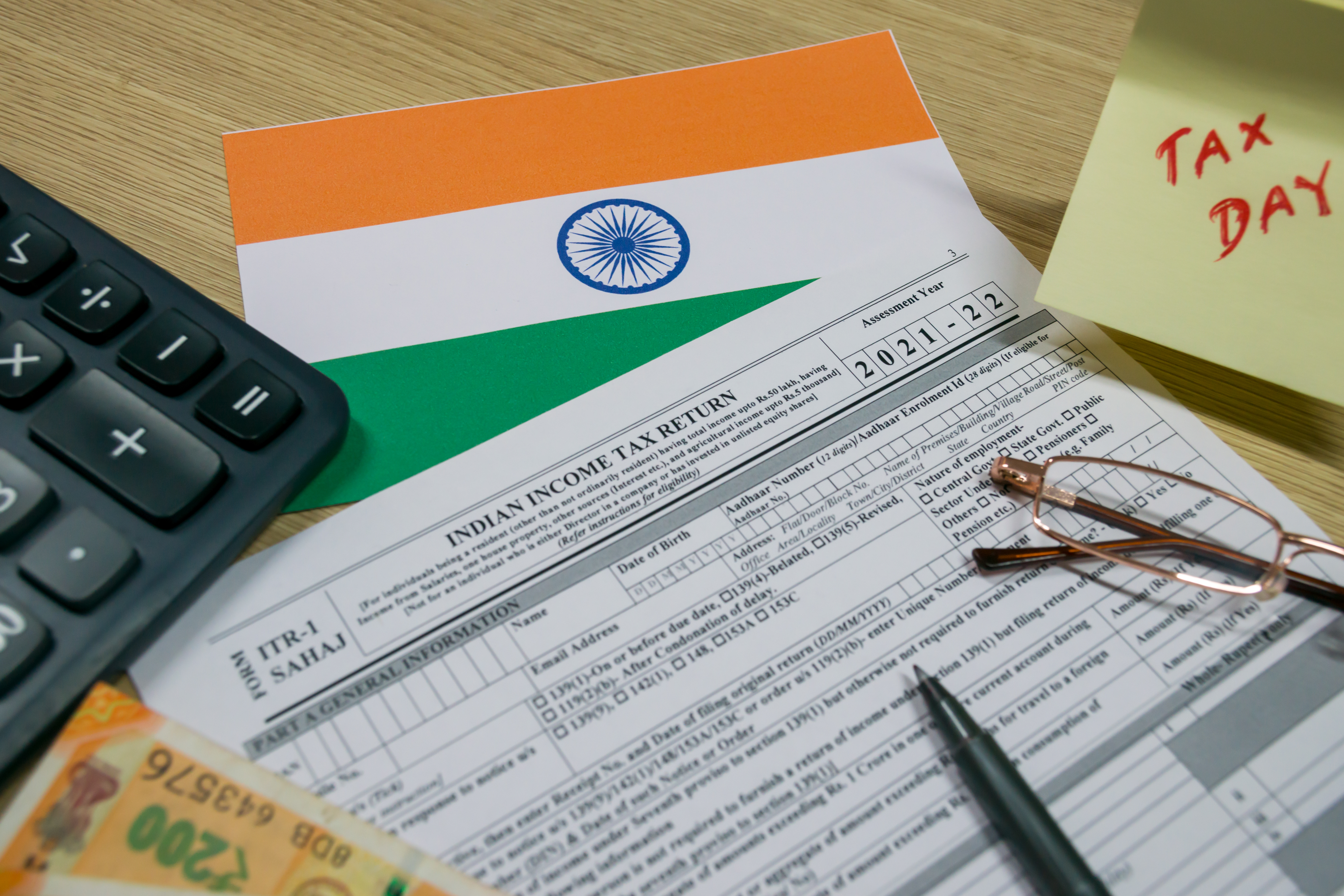 Income tax return filing concept with documents, calculator, and financial paperwork on a desk"